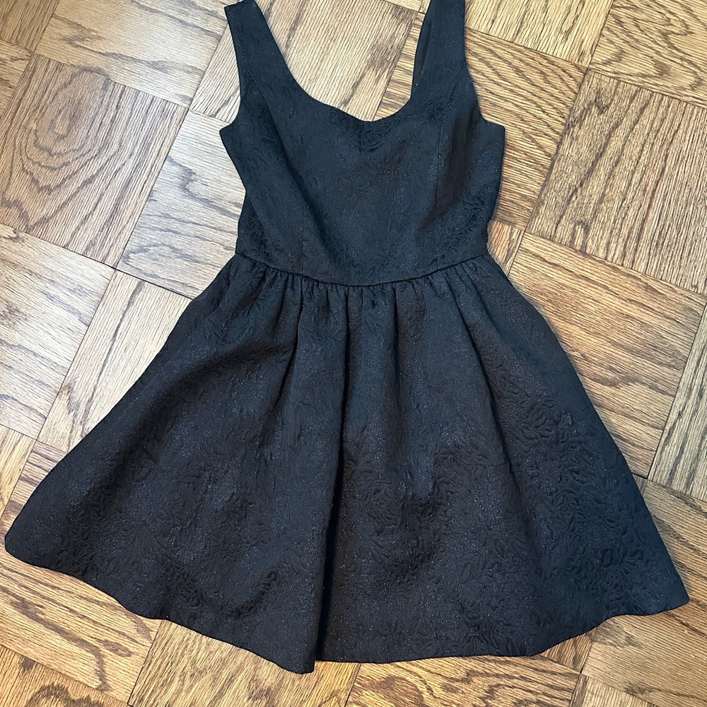 Black shirt dress with light sparkles and see through back